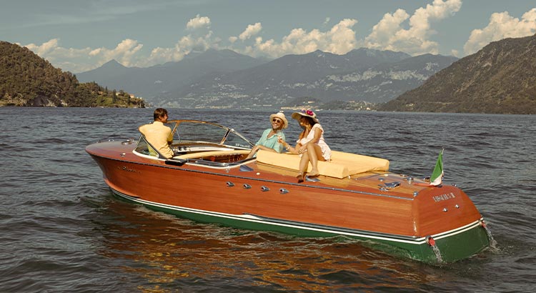 Riva Tritone luxury wooden boat sailing in Lake Como