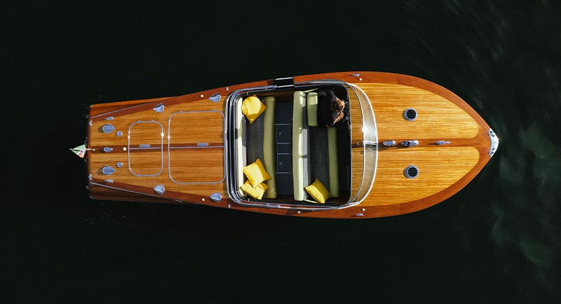 Riva Tritone luxury wooden boat sailing in Lake Como