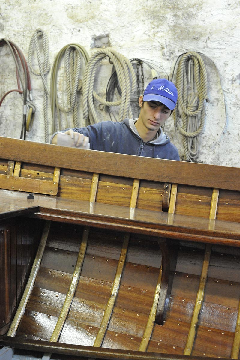 Boy working at Erio Matteri shipyard in Lake Como